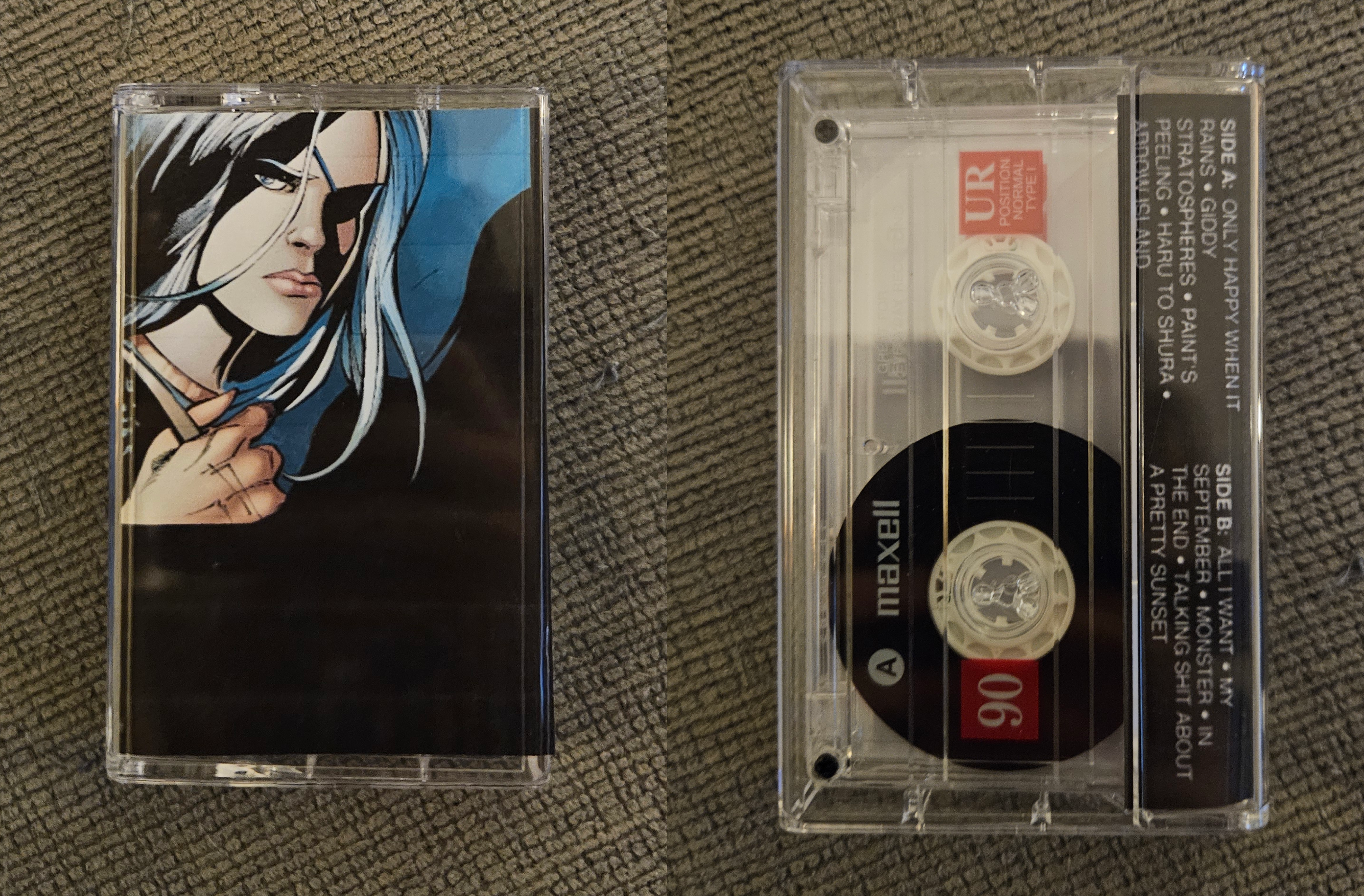 two photos edited together: left photo is of the front of a mixtape in a case. the j-card is an edit of rose wilson from dc comics looking very stern, with a not so seamless cut into black space that takes up the remainder of the cover. the right photo is the back of the mixtape, showing the small side of the j-card, which lists the songs on both sides, and through the transparent case is the tape contained inside, which is also made of a transparent plastic.